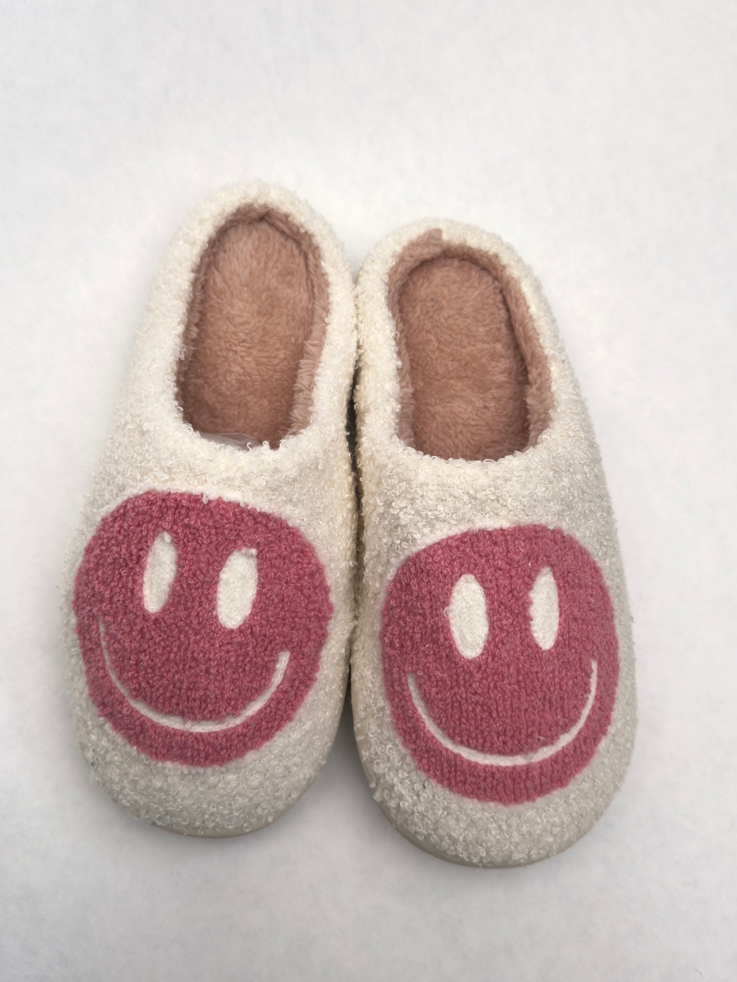 Pink smiley face slippers