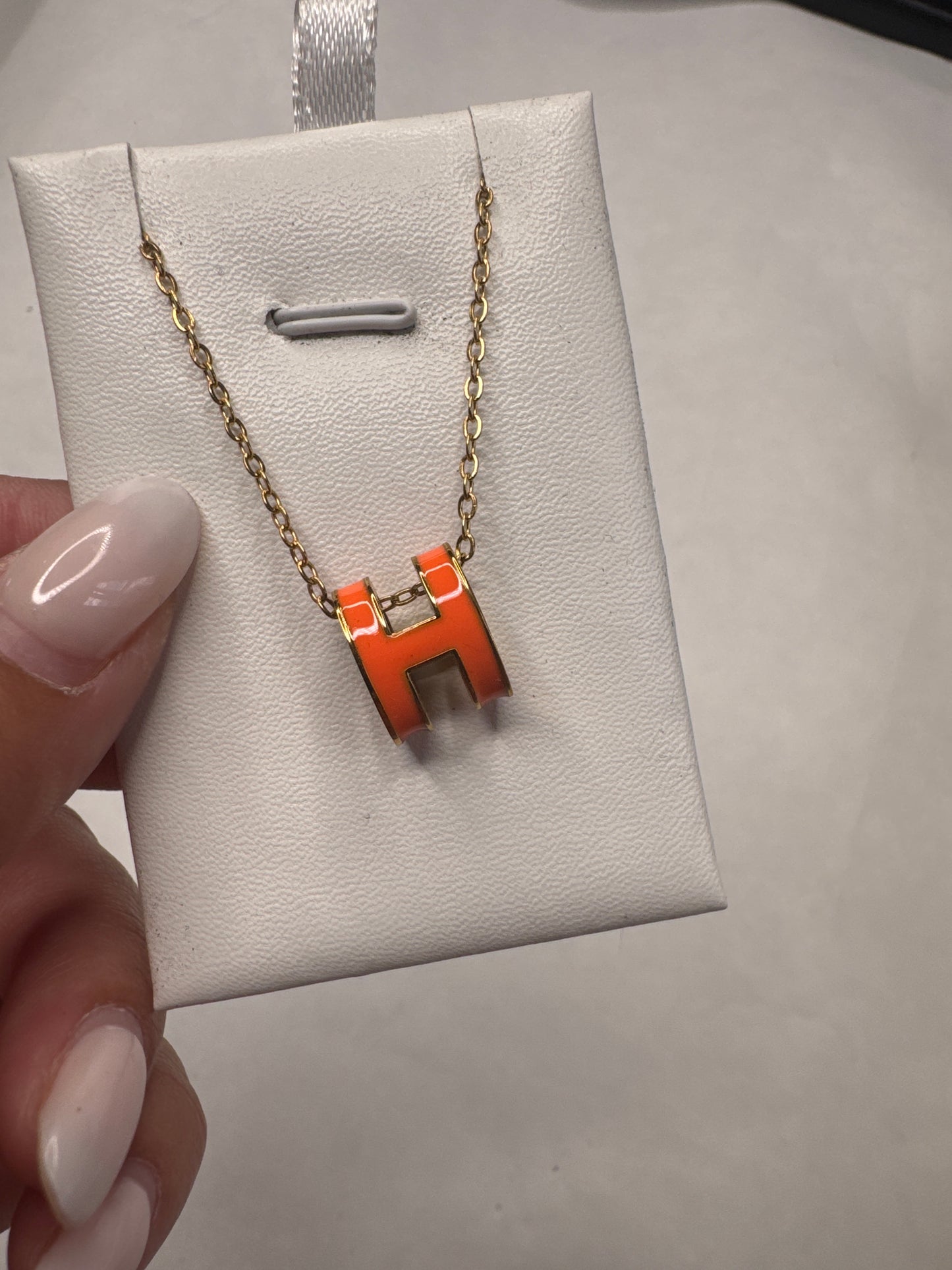Orange H necklace
