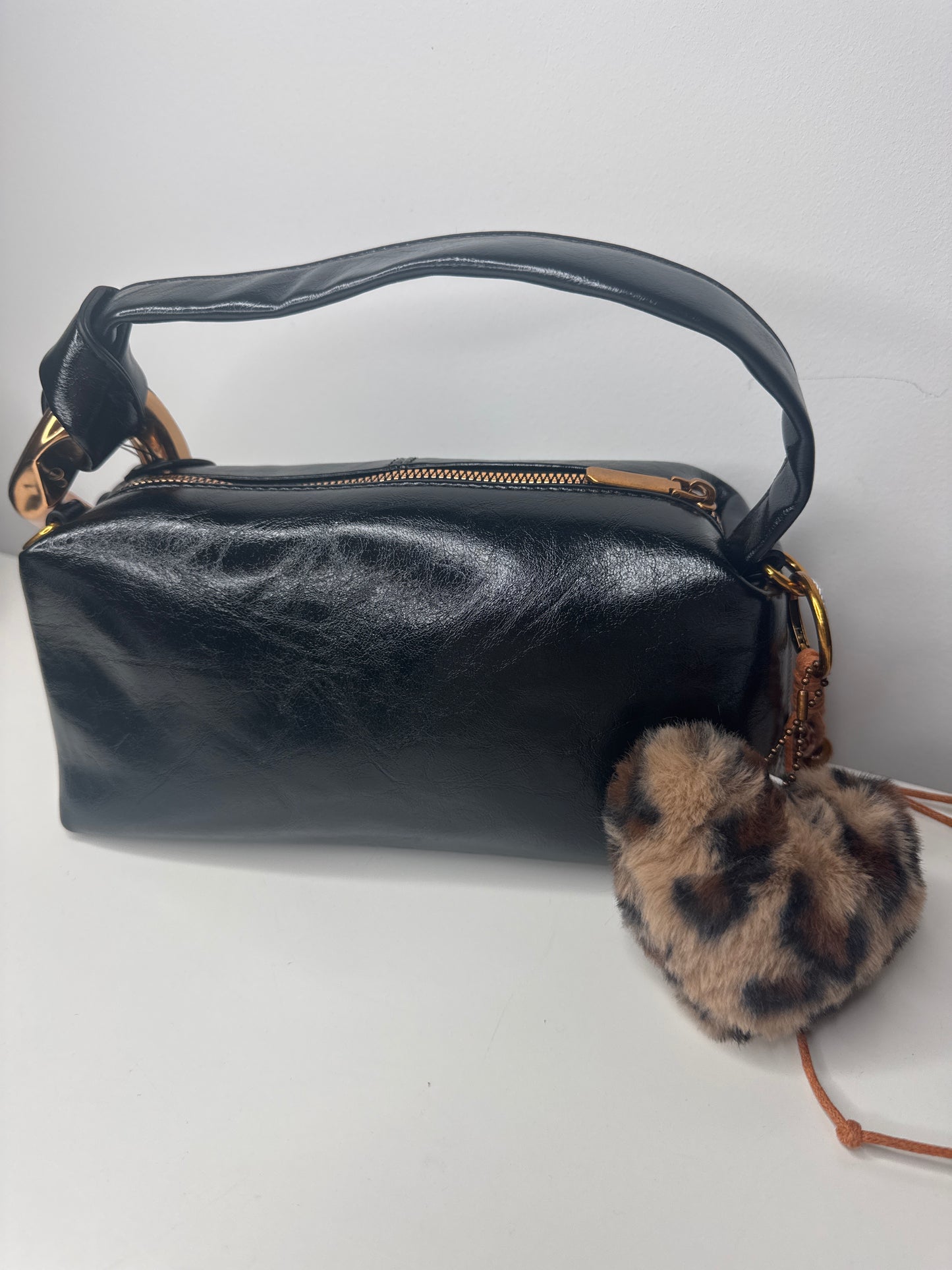 Black leather bag with leopard keyring