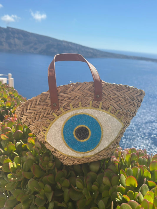 Evil eye woven straw bag