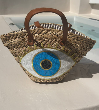 Evil eye woven straw bag